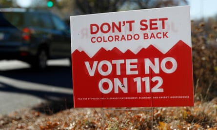 A sign in Denver last year urges voters to reject Proposition 112.