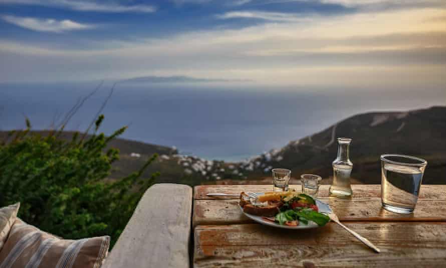 A tsipouro drink with meze and great view to the Aegean in Tinos.