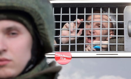 A protester shouts from a police bus after being detained during March’s anti-corruption rally in central Moscow.
