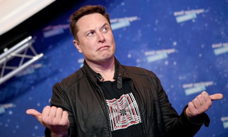 Elon Musk at an event pulling an uncertain face and making an equivocal gesture with both hands