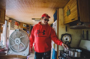 Ken Greene boils water in his home at the Six Nations Reserve in Ontario.