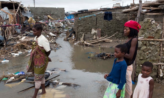 Residents survey the devastation caused by Cyclone Idai in the Mozambican city of Beira
