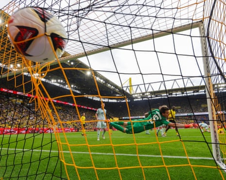 The ball hits the back of the net for Felix NmechaâÂÂs second goal as Borussia Dortmund beat Paderborn 3-0
