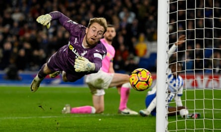 Southampton goalkeeper Joe Lumley dives and watches the ball in the 1-1 draw against Brighton at the Amex Stadium