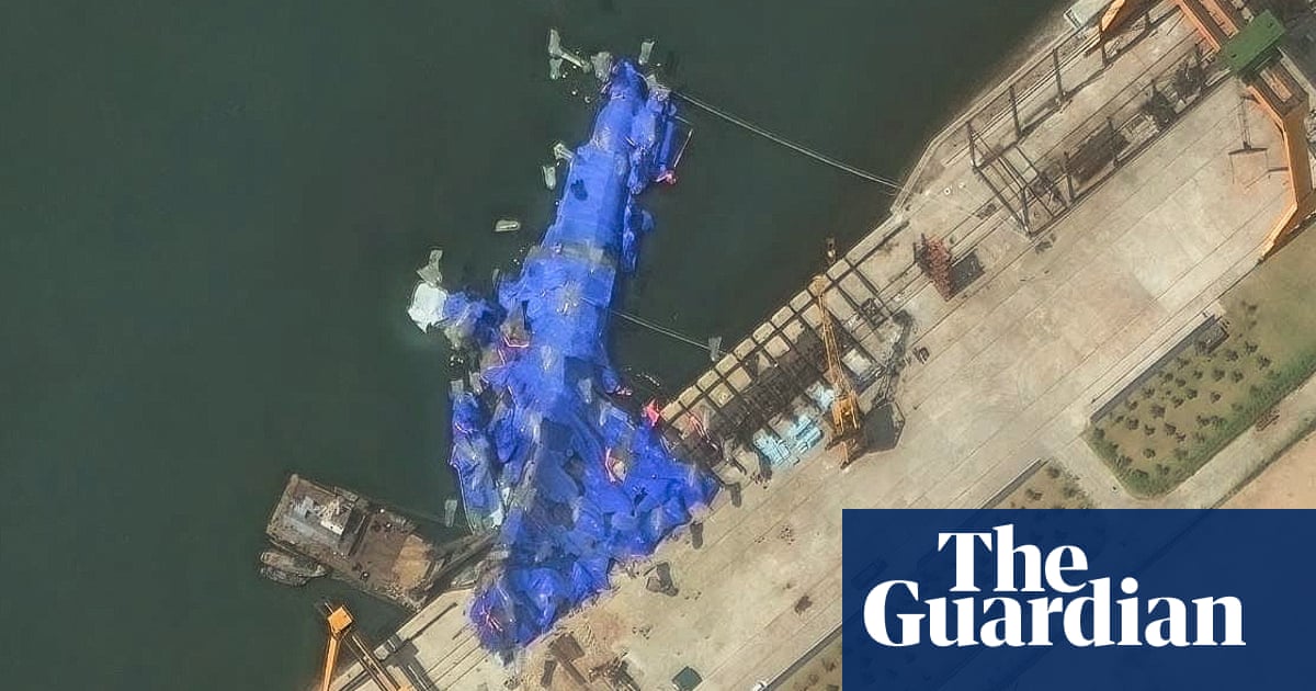 North Korea detains three over warship launch accident, state media reports