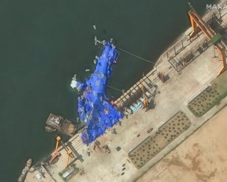 North Korea detains three over warship launch accident, state media reports