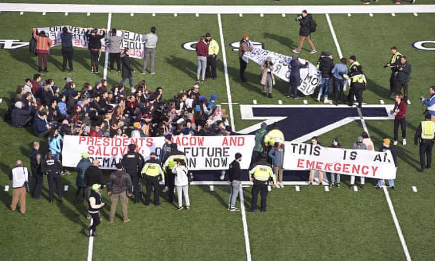 Demonstrators stage a climate change protest at the Yale Bowl in New Haven, Connecticut.