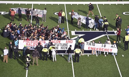Demonstrators stage a climate change protest at the Yale Bowl in New Haven, Connecticut.