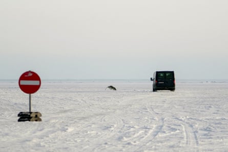 A vehicle drives on the new ice road in Estonia