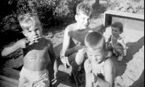 David Kaczynski, left, and his older brother Theodore John Kaczynski, center, in a sandbox with neighbors.
