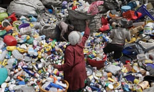 People sort through waste at a collection centre in Nairobi
