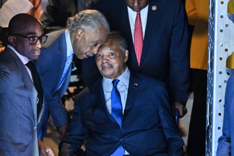 Rev Al Sharpton talks with Jesse Jackson before they go on stage on the first day of the Democratic Convention in Chicago in 2024.