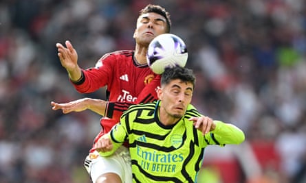Casemiro challenges for a header with Kai Havertz.