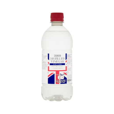 A glass bottle of Tesco Distilled Vinegar with a union jack label and dark red screw top lid