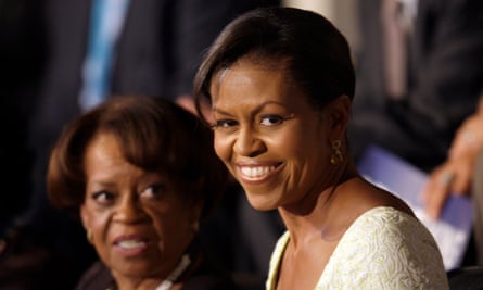 Woman smiles standing next to mother