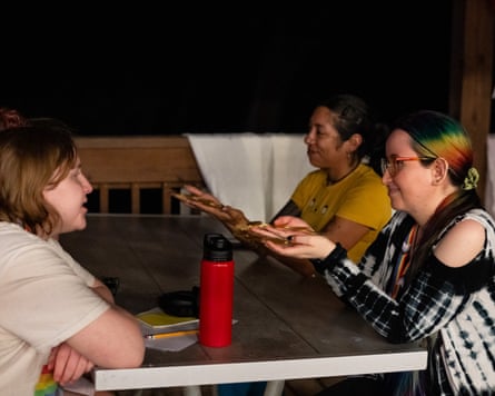 House leaders Blanco and Samantha Escandón present laurel crowns to their campers Velvet and Pasivan during the opening ceremony. Campers were asked to share their intentions for camp, receiving these crowns as a reminder that having the courage to be themselves is part of their own heroic journey.