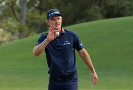 England's Justin Rose acknowledges the crowd after holing a birdie putt on the 8th.