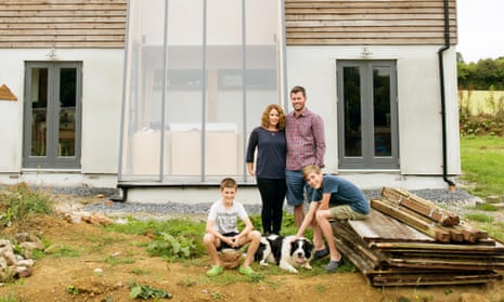 Family in front of eco-home
