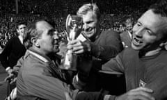 1966 World Cup Winner Nobby Stiles Dies Aged 78 World Cup Win<br>(FILE PHOTO) 1966 World Cup Winner Nobby Stiles Dies Aged 78 announced on October 30,2020 England Manager Alf Ramsey (left) celebrates his team's 4-2 victory in extra time over West Germany in the World Cup Final at Wembley Stadium. With him is captain Bobby Moore (1941 - 1993), holding the Jules Rimet Trophy, and team mate Nobby Stiles, 30th July 1966. (Photo by Hulton Archive/Getty Images)