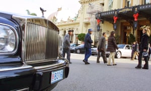 A luxury car in front of the Monte Carlo casino in Monaco.