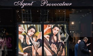 Men walk past a branch of Agent Provocateur in London.