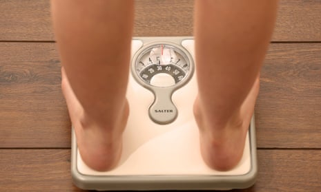 Person stands on scales