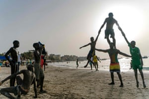 Malick teaches an acrobatics class to young people on Ngor beach in Dakar.