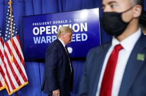 Donald Trump departs after delivering a speech as a member of his U.S. Secret Service detail keeps watch during a tour of the Fujifilm Diosynth Biotechnologies’ Innovation Center.