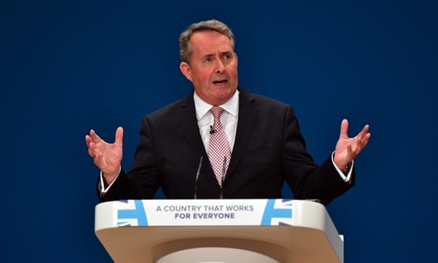 Liam Fox speaking at a podium at the Conservative party conference