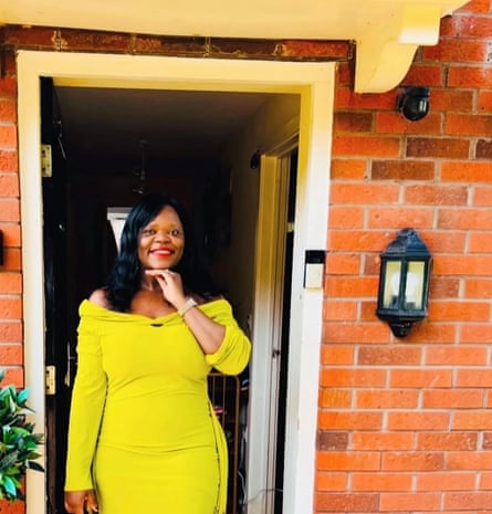 Paola Adeitan standing at the entrance of a house with the front door open
