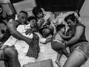 Filipina street photographer Xyza Cruz Bacani captures her family together at their home in the Philippines
