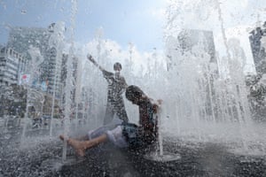 Children play in a fountain