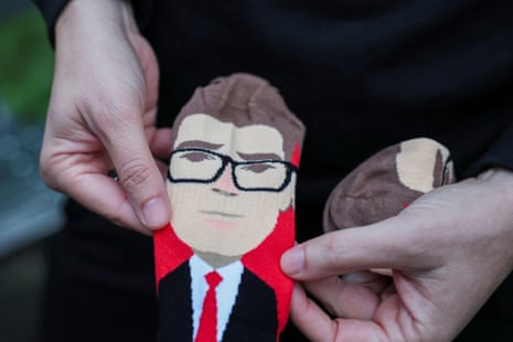 Josh Turner showing the Andy Burnham socks his firm has produced.