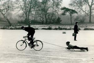 Children play on ice on a pond on Wimbledon Common, 9 January 1970