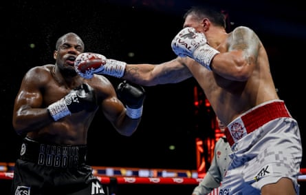 Oleksandr Usyk punches Daniel Dubois.