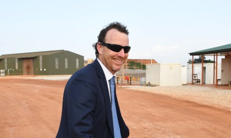 Sébastien de Montessus smiling wearing a suit and sunglasses.