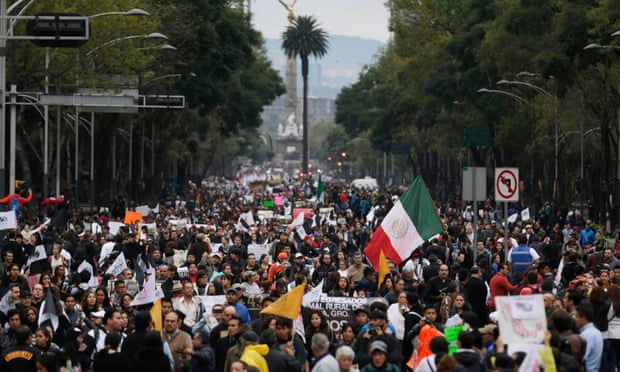 Demonstrators march on Reforma Avenue during a protest in support of 43 missing Ayotzinapa students in Mexico City.