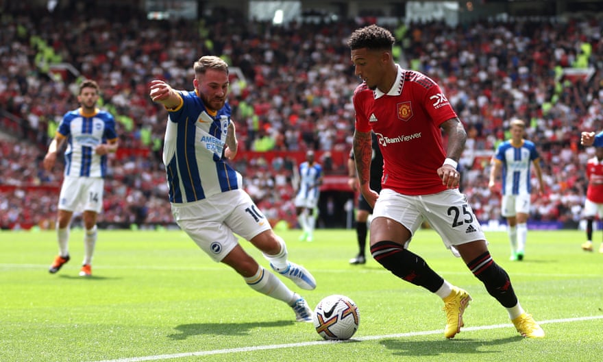 Manchester United's Jadon Sancho is put under pressure by Brighton's Alexis Mac Allister