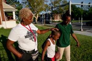 Chante Bass, from left to right, talks her son, Taron Henton, 7, and daughter, Tajaé Redden, 13, as they play outside their home in St. Louis on Thursday, Sept. 12, 2019. The family lives in north St. Louis, which has long been plagued by gun violence. At least 13 children have died of gunshot wounds in St. Louis city this year, and six children in St. Louis Country have been killed by gunfire.