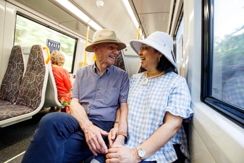 Garry Reynolds and his partner, Selina Ellis, chat on the train from Nambour to Brisbane on their ‘budget day out’.