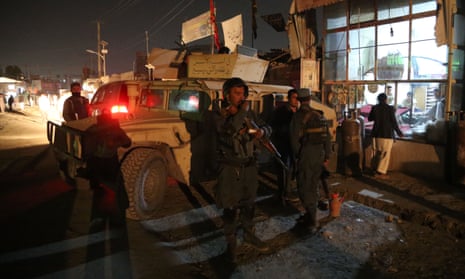 Afghan security forces stand at the site of an attack at a Shiite mosque in Kabul.