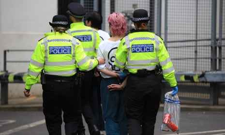 A Just Stop Oil activist is arrested outside the National Gallery.