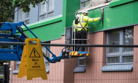 Cladding is removed from a tower block in Sheffield.