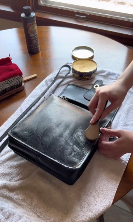 Two hands cleaning a bag stuffed with paper so it holds its shape