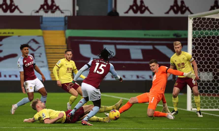 Nick Pope saves with his feet to deny Bertrand Traoré.