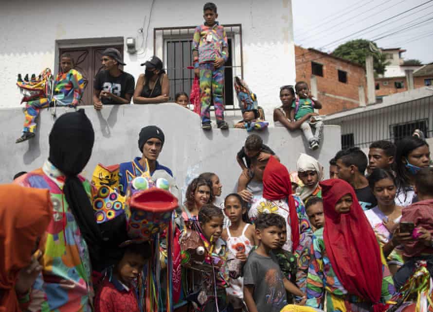 People dressed in devil costumes celebrate the Catholic holiday of Corpus Christi in Naiguata, Venezuela, 3 June