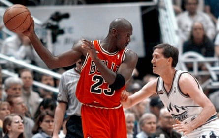 Michael Jordan of the Chicago Bulls keeps the ball away from Utah Jazz guard Jeff Hornacek during the 1998 NBA finals