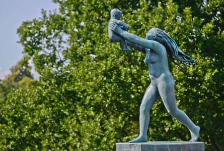 A sculpture of a woman holding a child