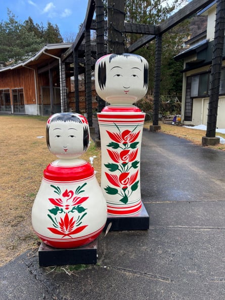Traditional kokeshi dolls outside the railway station at Naruko Onsen in northern Japan. The dolls, carved from a single piece of wood, are popular souvenirs for visitors to Japanese onsen resorts.