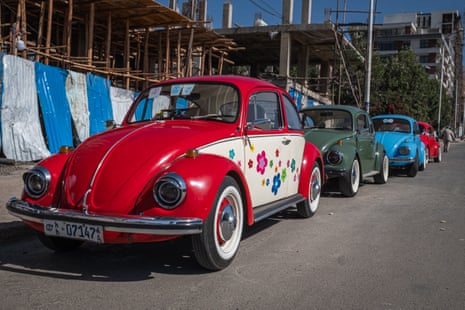 VW Beetles parked nose to tail in a line in Addis Ababa, Ethiopia